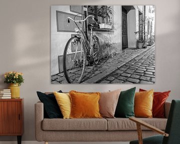 Old bicycle in an alley by Animaflora PicsStock