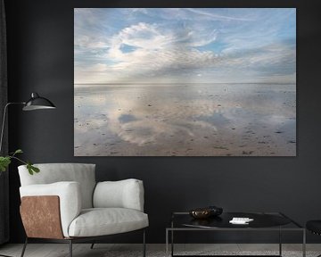 Wolkenlucht spiegeling op het Wad