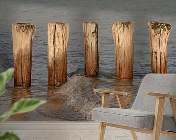 A wave washes up on the beach of Cadzand by Marjolijn van den Berg