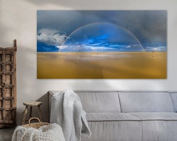 Regenboog op het strand van Texel panorama