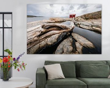 Withered tree trunk and rocks in western Sweden by Martijn Smeets