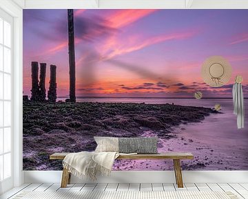Zonsondergang tijdens eb met mooie kleuren van Rick van de Kraats