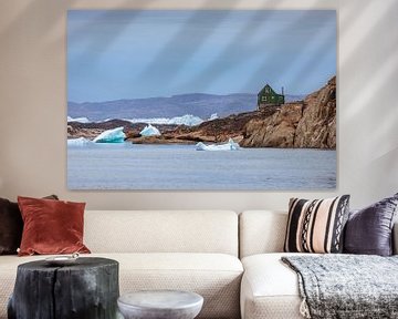 Ice floes in front of a house in Aappilattoq, Greenland by Martijn Smeets