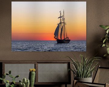 Sailing ship in the sunset at the Hanse Sail in Rostock by Rico Ködder