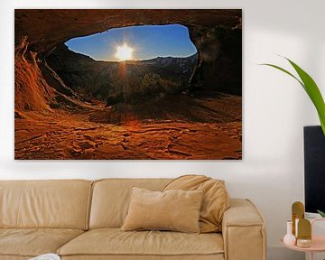 Golden sunset illuminating sandstone cave arch