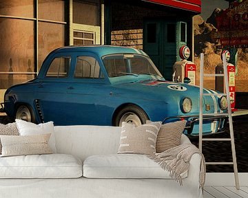 1957 Renault Dauphine Gordini bij een vintage benzinestation
