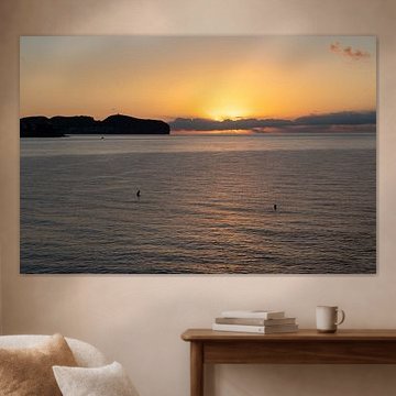 Sea water and golden sky at sunrise