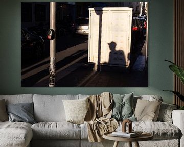 Shadow of passerby on meter box in Nice, Côte d'Azur, France