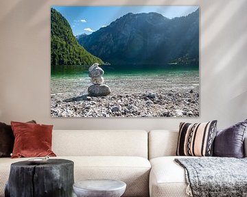 Stacked stones on the mountain-fringed lake Königssee in Germany by Moniek van Rijbroek