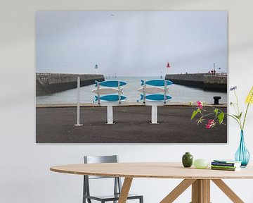 Cheery chairs on an overcast day in Deauville harbor by Robin Mulders