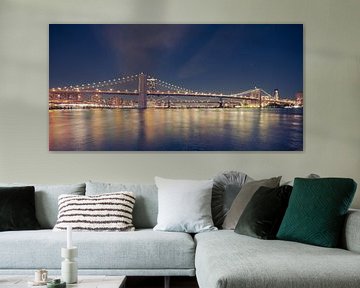 Brooklyn Bridge over East River in New York City at night by Robert Ruidl