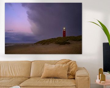 Texel lighthouse in the dunes during a stormy autumn evening