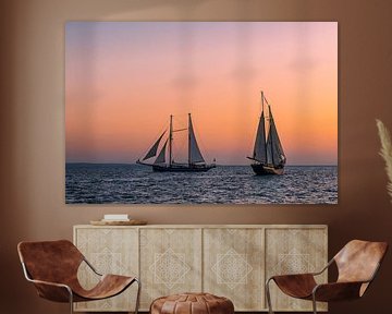 Sailing ships in the sunset at the Hanse Sail in Rostock by Rico Ködder