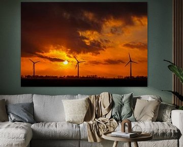Wind turbines in a colorful autumn sunset with sunlight behind the clouds by Sjoerd van der Wal Photography
