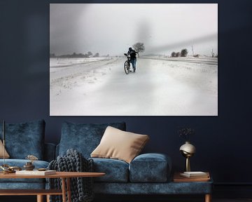 Girl with bike in blizzard in Zeeland by Wout Kok