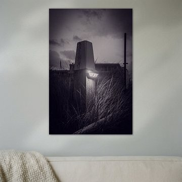 De lichtgevende strandpaal