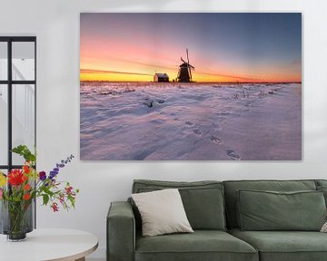 Windmill de Koker in the snow during sunrise by Pieter Struiksma