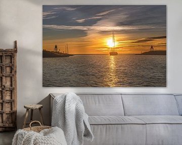 Sunset over the harbor entrance of Stavoren, Friesland.