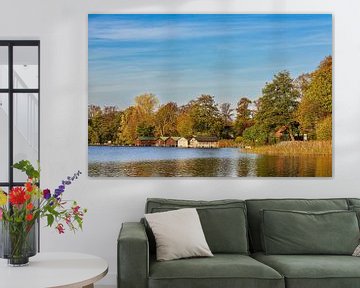 View over house lake to boathouses in town Feldberg by Rico Ködder