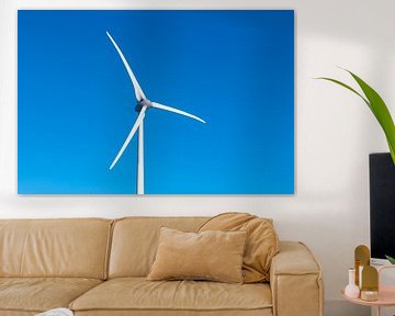 Wind turbine with a clear blue sky in the background by Sjoerd van der Wal