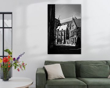 alley with cyclist in Bruges, Belgium by Patrik Hochnadel