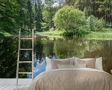 Reflection of trees in calm water 2 by Adriana Müller
