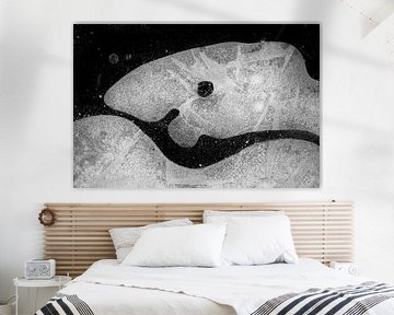 Ice figure in black and white looks like a friendly fish by Karin de Jonge