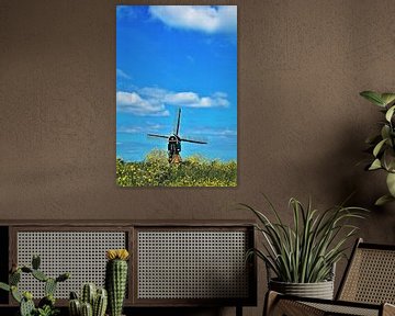 Dutch mill with yellow rapeseed and cloudy sky by Maud De Vries
