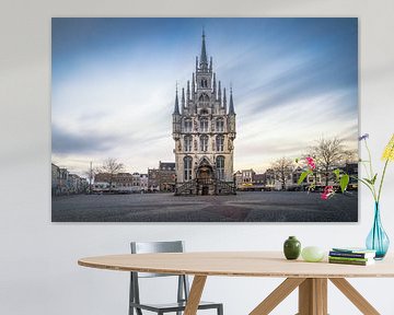 Gouda town hall with flag and sunset