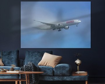 SWISS Boeing 777-300 emerges from the fog. by Jaap van den Berg