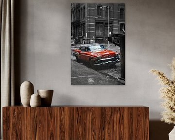 Red classic car in black and white environment New York 1980 by Albert Brunsting