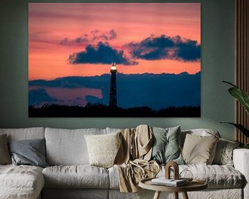 The ameland lighthouse in evening red