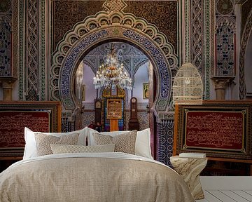Man sits inside Al Quaraouiyine mosque in Fez by Rene Siebring