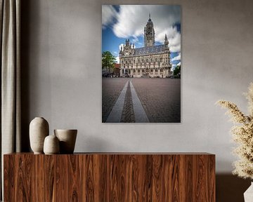 Middelburg town hall in Zeeland netherlands with beautiful clouds and people on the square