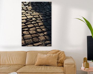 Cobbles of a street by Heiko Kueverling