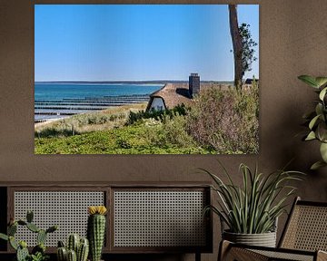 Thatched roof house in the dunes by Juergen May