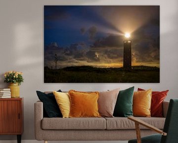 Lighthouse in the dunes with lightbeams at night by Sjoerd van der Wal