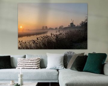 Windmill in Beesd at sunrise and fog