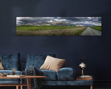 Panoramic landscape, meadows, country road and mountains in New Zealand by Albert Brunsting