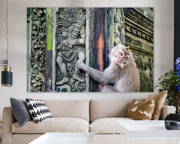 Monkey climbs on a temple. by Floyd Angenent