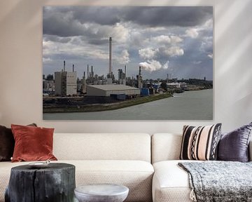 view of an industrial estate with chimney smoke