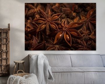 Two star anise on top of star anise in warm colours by Marjolijn van den Berg