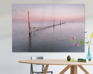 Fishing nets in the Markermeer during sunset by Gijs Rijsdijk