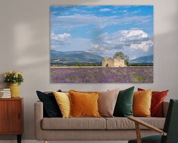 a lavender field with an old ruin by Hillebrand Breuker