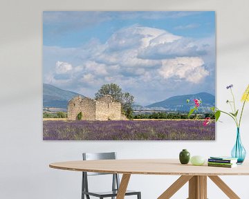 A lavender field with an ancient ruin by Hillebrand Breuker