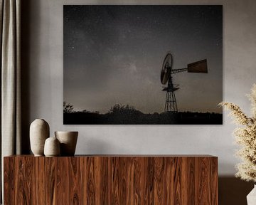 An American windmill against a sparkling starry sky by Hillebrand Breuker