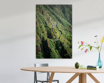 A Volkswagen Beetle on a winding mountain road