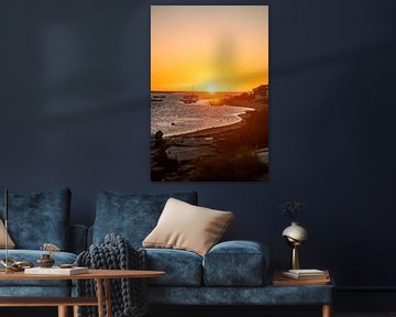 Sunrise on the Algarve coast with boats and beach by Leo Schindzielorz