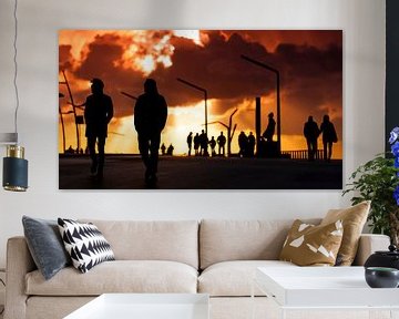 Silouettes of walkers on Scheveningen promenade by Rob Kints