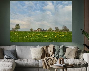 Paardenbloemen in de wei met boerderij op de achtergrond van Ad Jekel